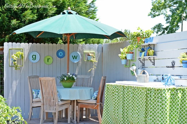 Grow letters on a wooden fence in a garden