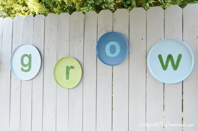 Diy grow letters on a wooden fence