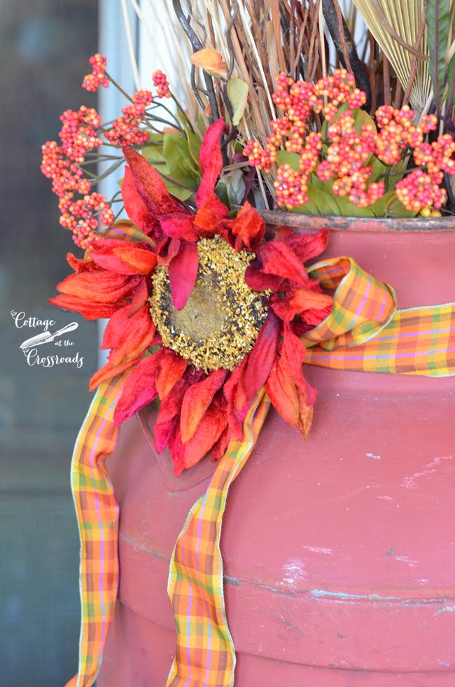 Old milk can decorated for fall