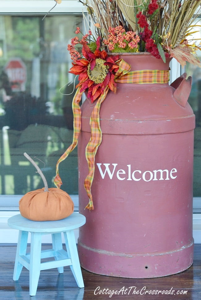 Old milk can dressed for autumn