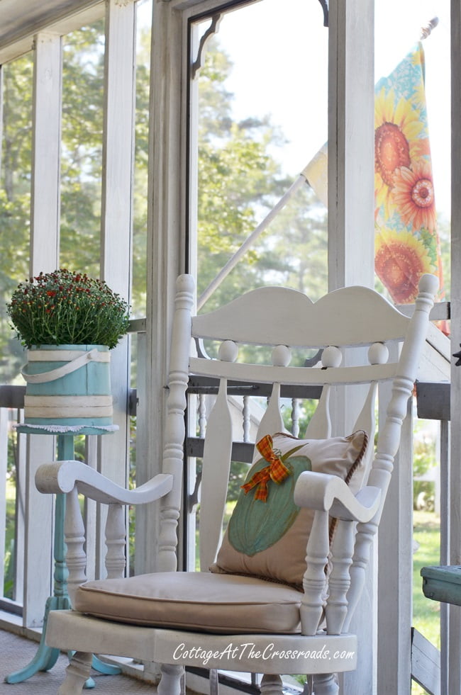 Rocking chair on a fall front porch