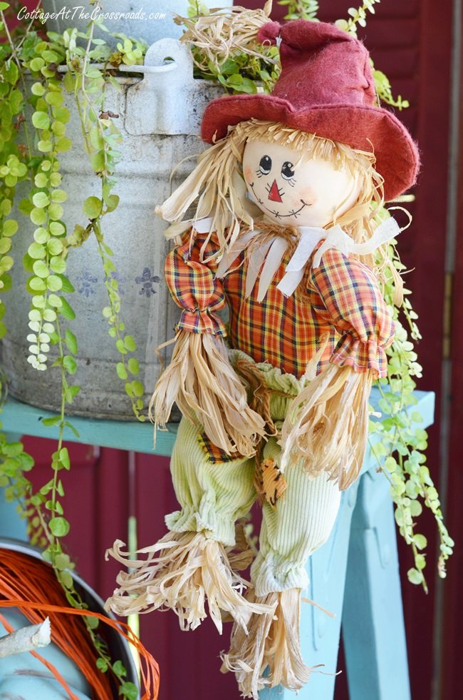 Scarecrow on a fall front porch