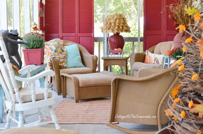 An aqua autumn porch sitting area