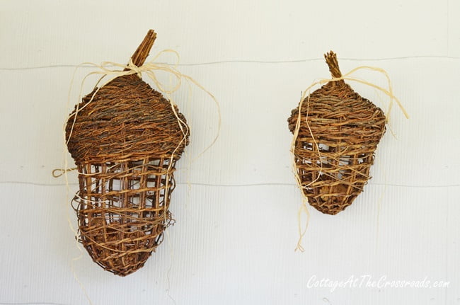 Giant wicker acorns on a fall front porch