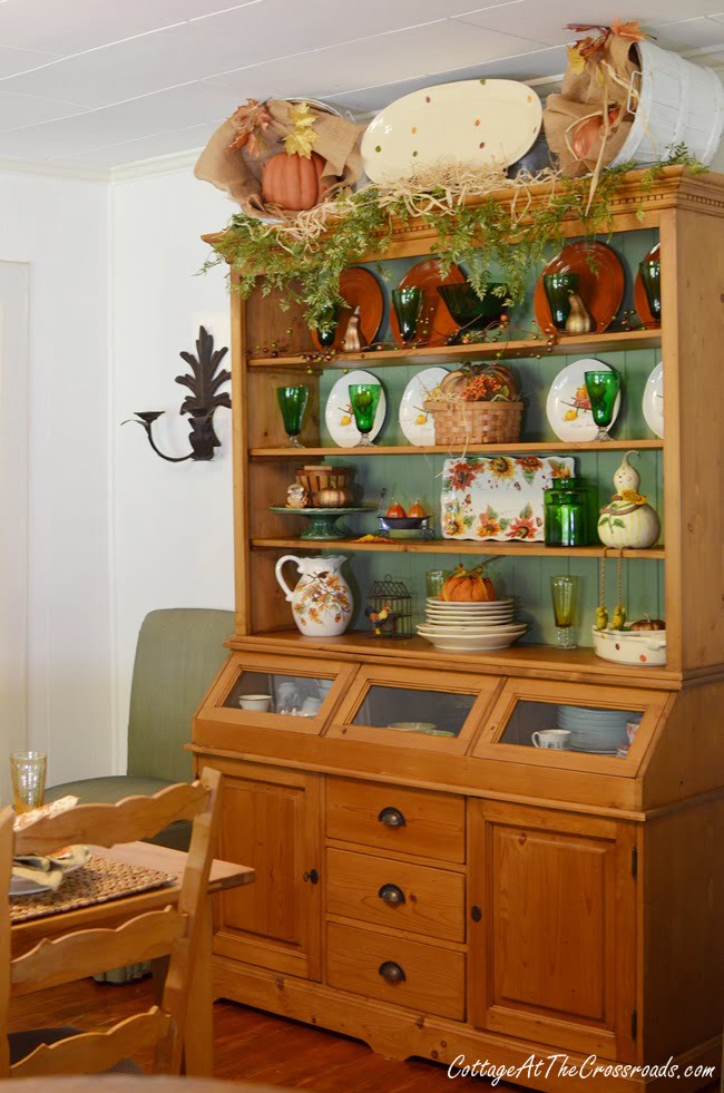 Pine cupboard decorated for fall