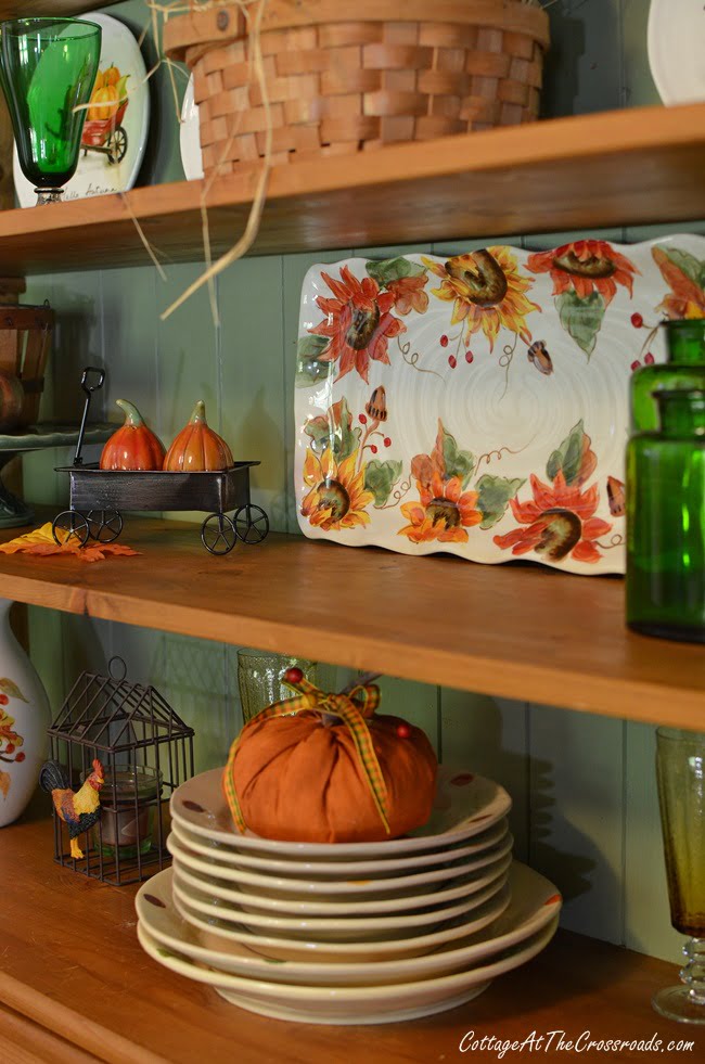 An autumn decorated farmhouse cupboard