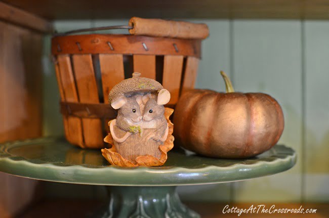 Mice figurine on an autumn cupboard