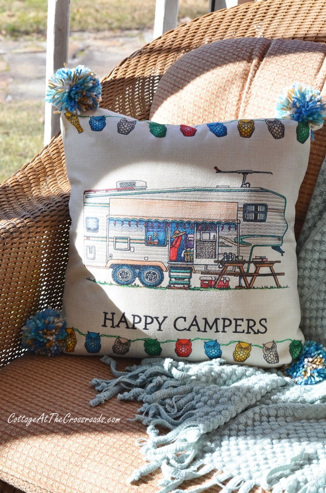 Happy campers pillow on a vintage camper christmas porch