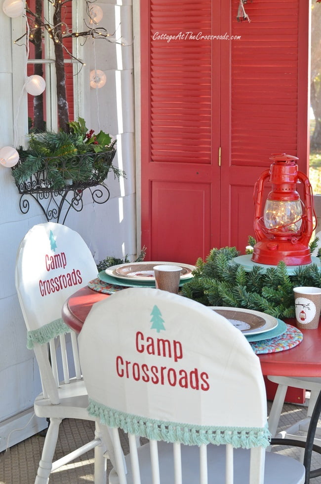 Camping theme table on a christmas front porch