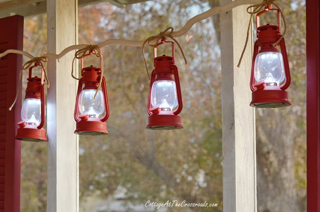Red lanterns on a vintage camper christmas porch