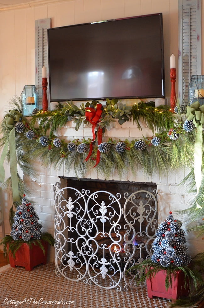 Christmas mantel with pine cone trees