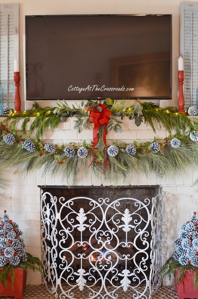 Christmas mantel with pine cone trees