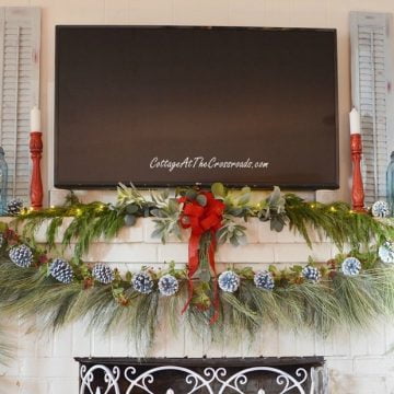Traditional Christmas mantel with painted pine cone trees