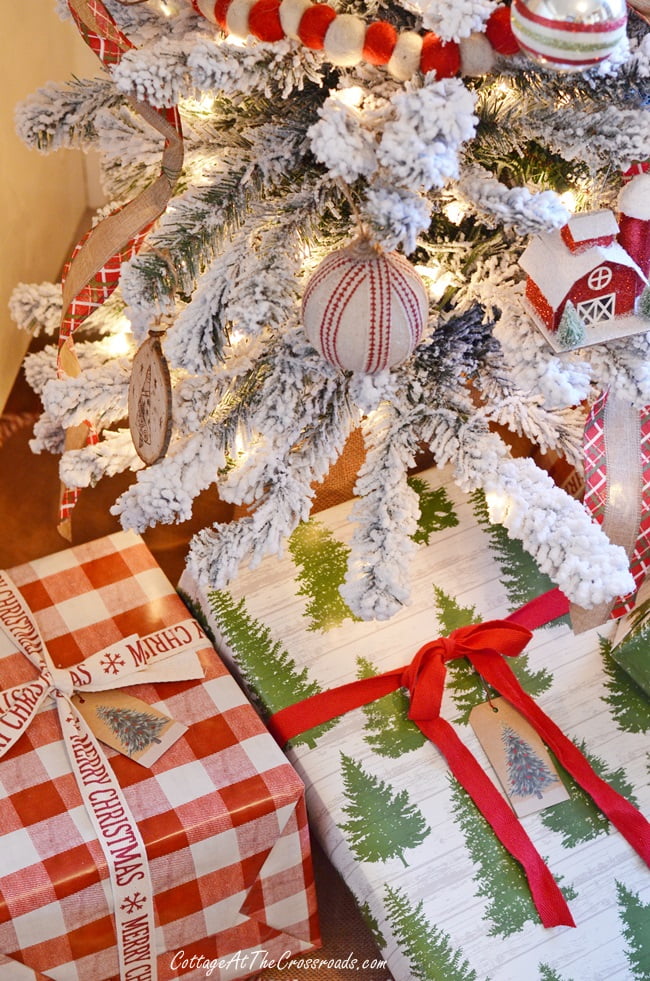 Packages under a flocked christmas tree