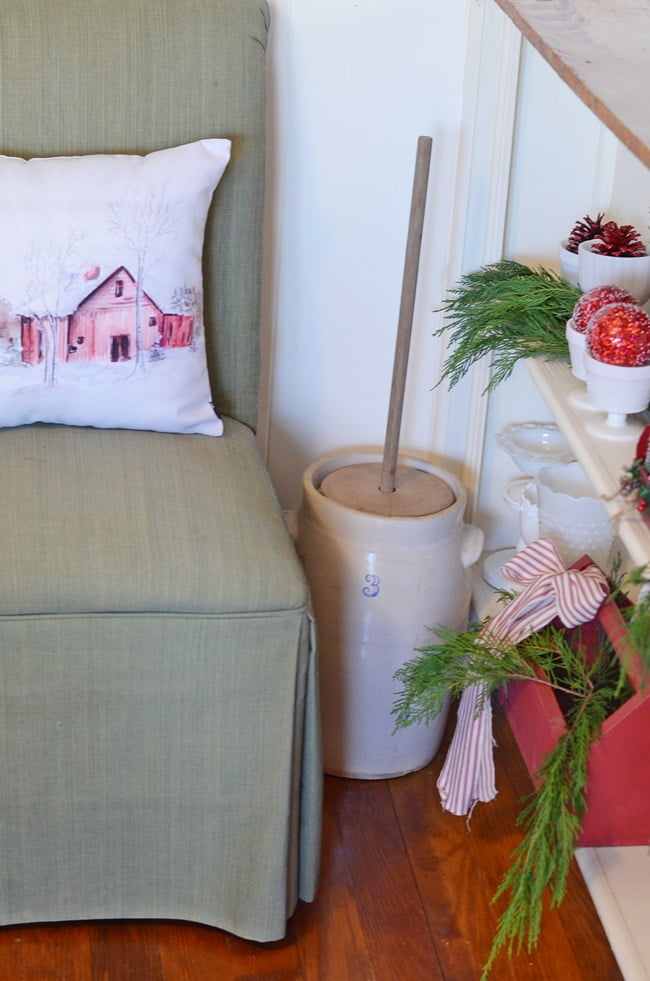 Red barn pillow in a chair