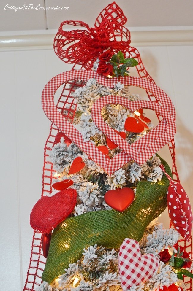 Gingham fabric covered wooden hearts used as a tree topper