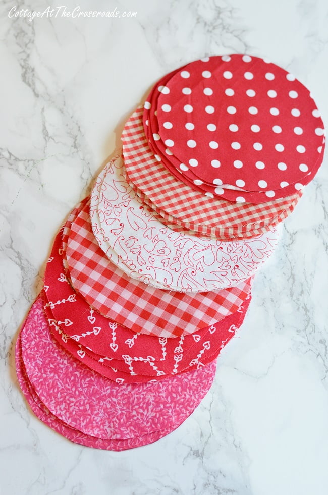 Cut circles of red fabric for making yo-yos