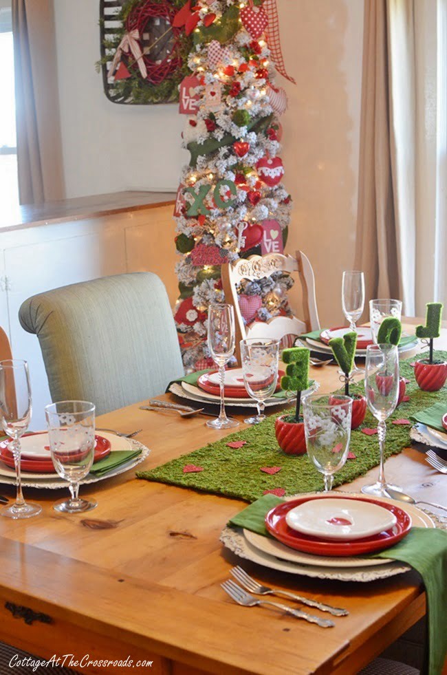 Valentine's day tablescape beside a decorated tree