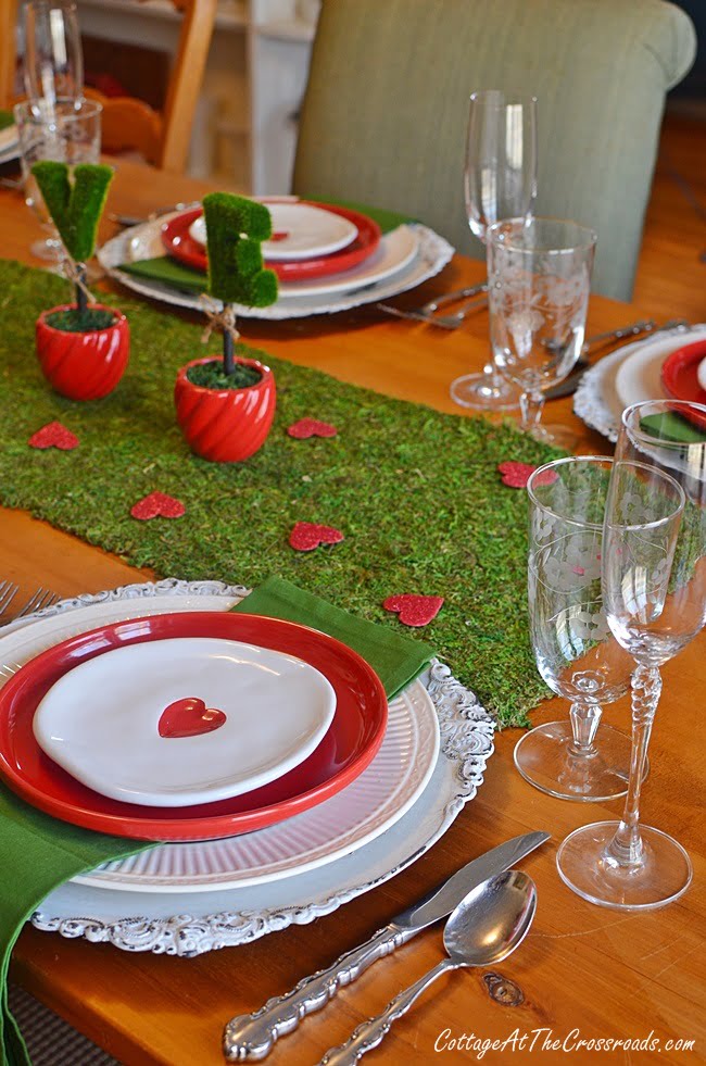 White appetizer plates with a red heart