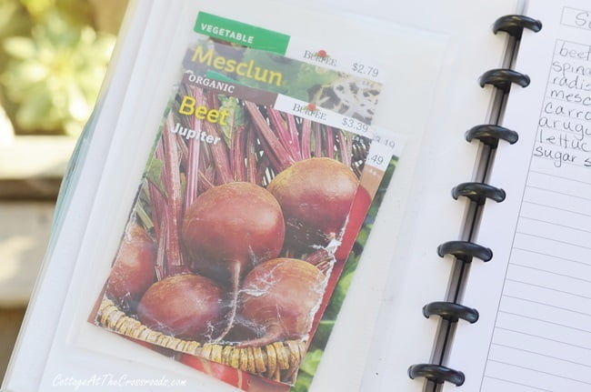 Seed packets kept in a garden journal