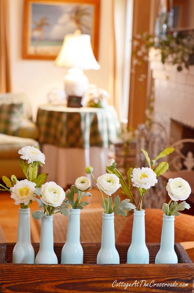 Aqua painted bottle spring centerpiece