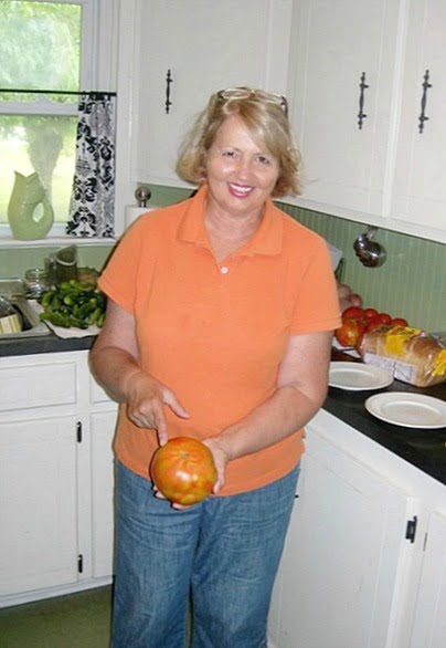 Hand held huge homegrown tomato