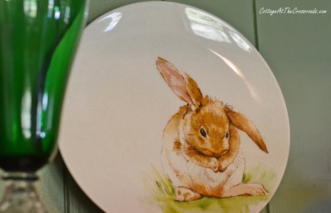 Bunny plates displayed in a pine cupboard on a spring tour