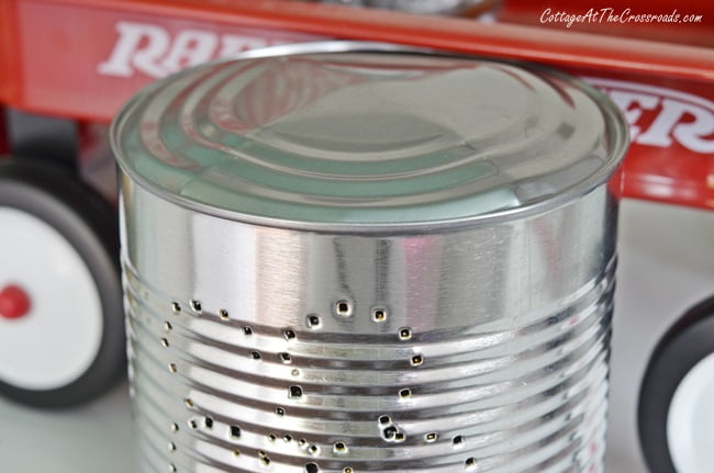 Bulging bottom of punched tin can