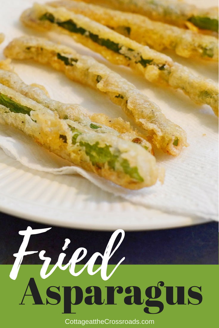 This beer battered fried asparagus with a spicy dipping sauce will disappear fast. You can easily recreate this restaurant favorite at home. #friedasparagus #beerbatter