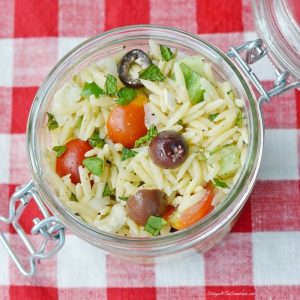 Orzo salad in a glass container