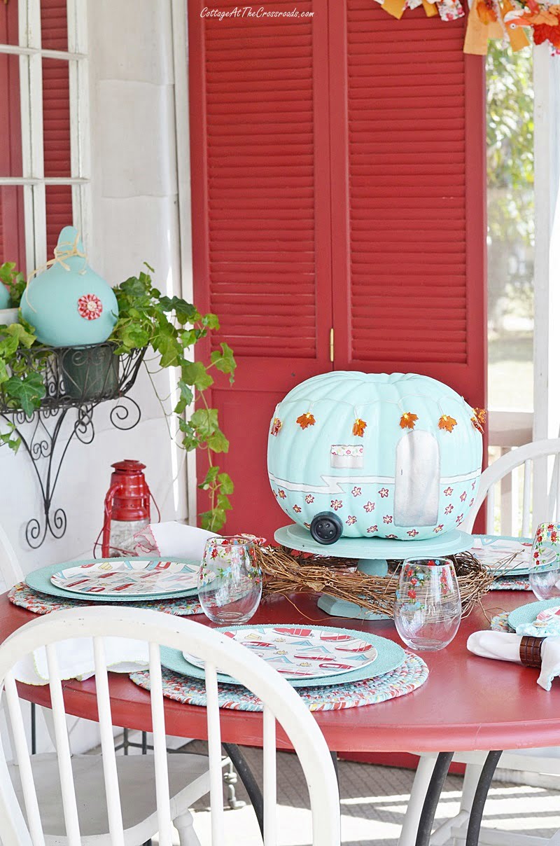 Fall front porch with a camping theme tablescape