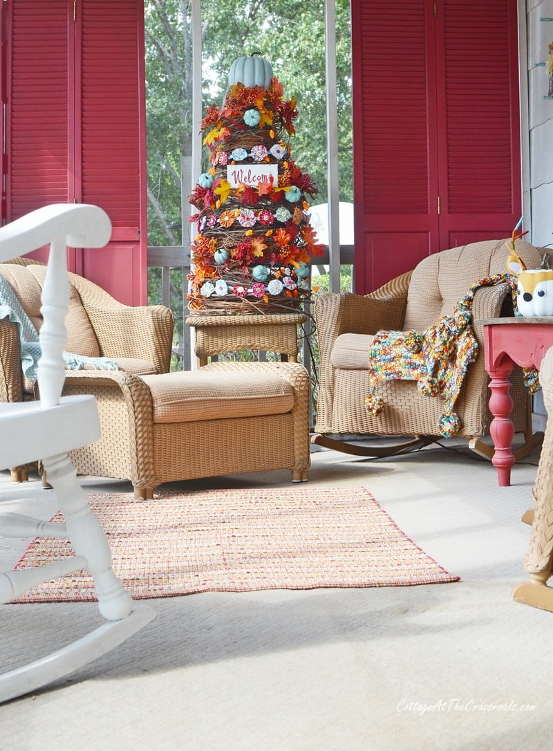 Sitting area of our campy fall front porch