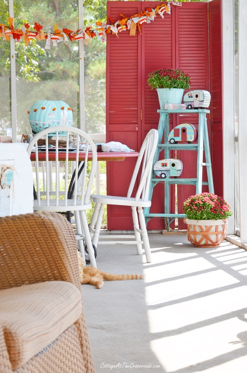 Eating area of our campy fall front porch