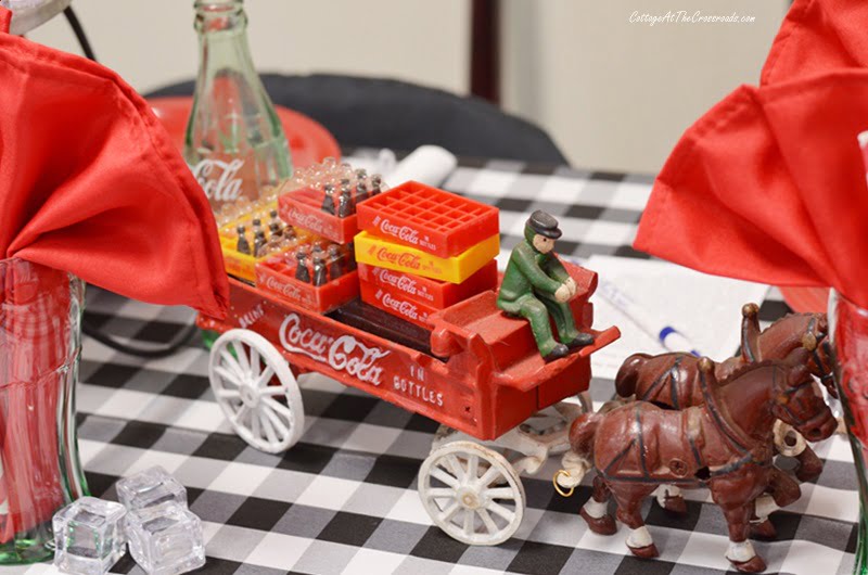 Vintage horse drawn wagon carrying cases of coca-cola