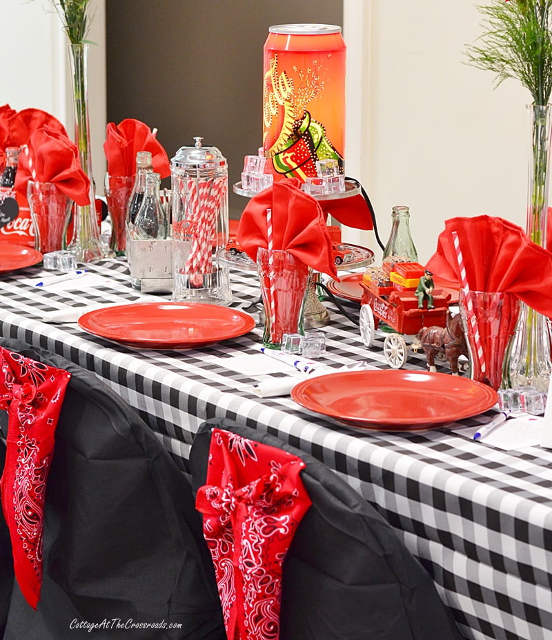 Coca-cola tablescape with red bandanas on the chair covers