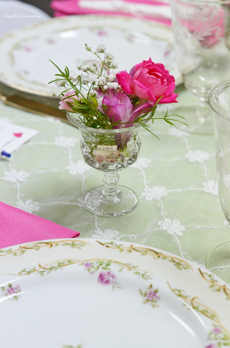 Tiny floral arrangements in cordial glasses