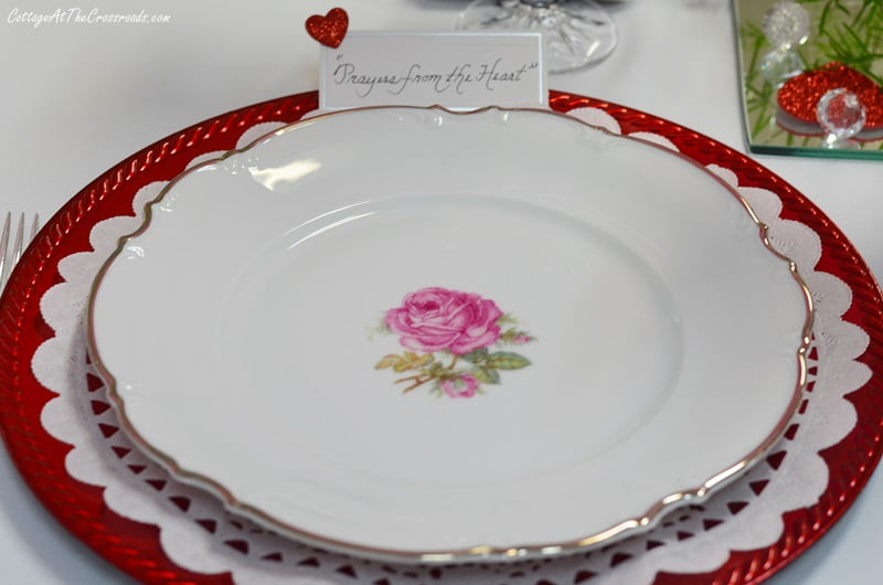 Vintage china with a pink rose in the center