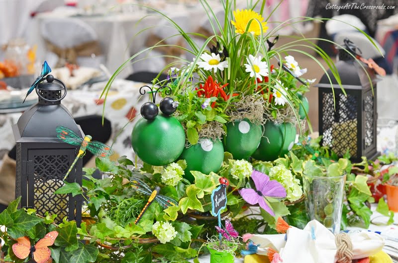 Floral centerpiece in a caterpillar planter