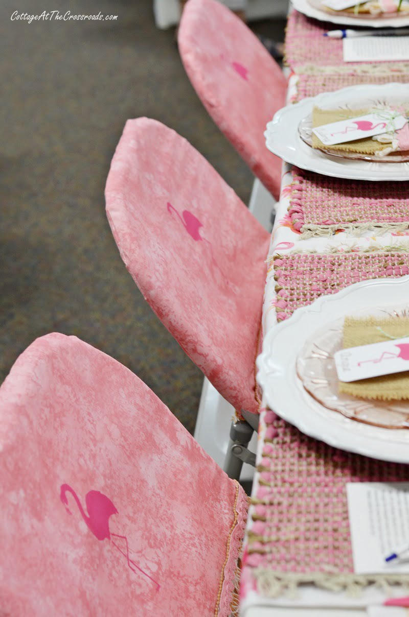 Chair covers with stenciled flamingos