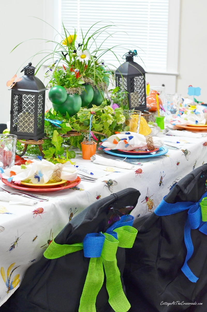 A tablecloth with insects on it