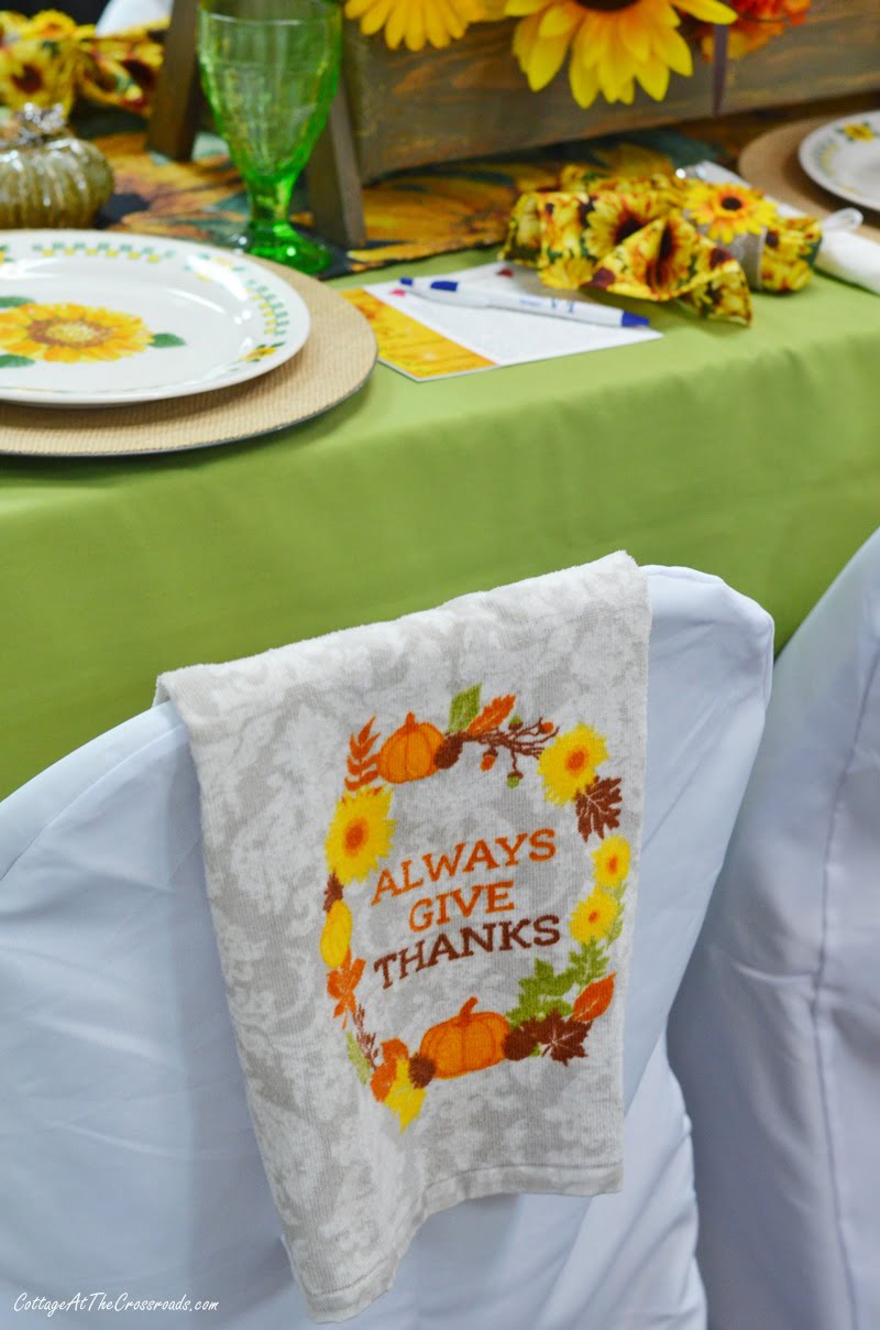 Tea towel used as a decoration on a chair cover