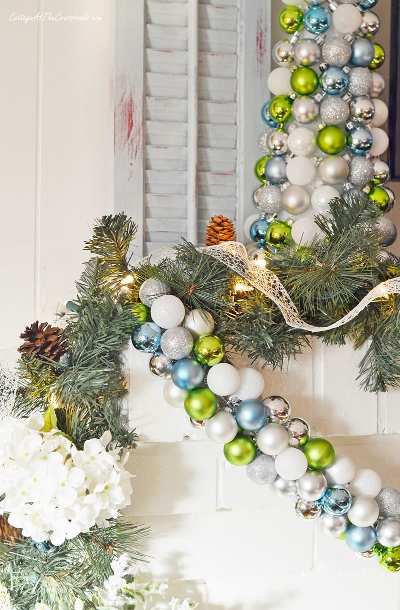 Faux white hydrangeas used on a christmas mantel