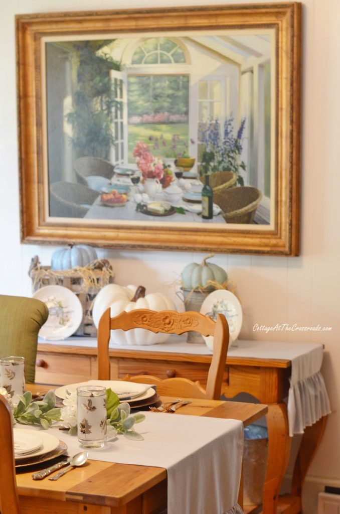 Thanksgiving tablescape with blue and white ruffled table runners