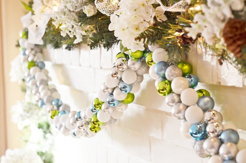 Diy christmas ornament garland in shades of green, blue, silver, and white