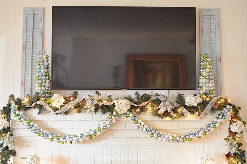 Ornament garland on a christmas mantel