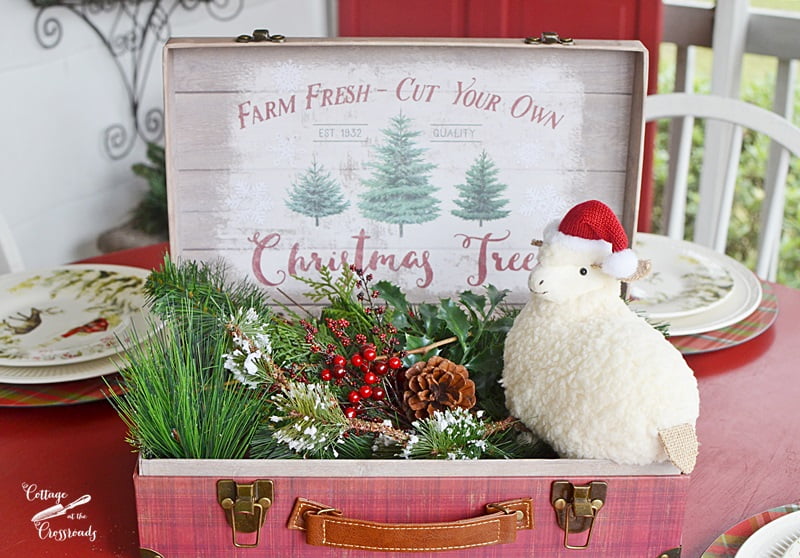 Farmhouse centerpiece on a christmas front porch