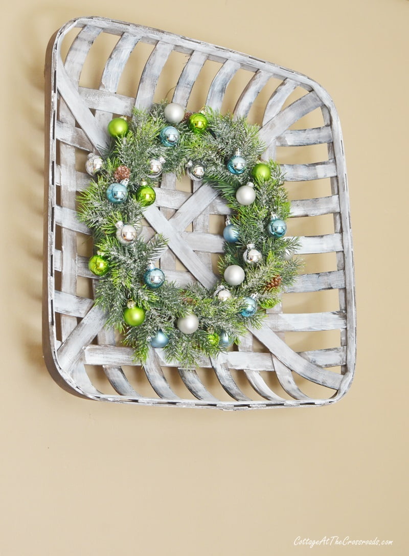 Christmas ornament wreath in a tobacco basket