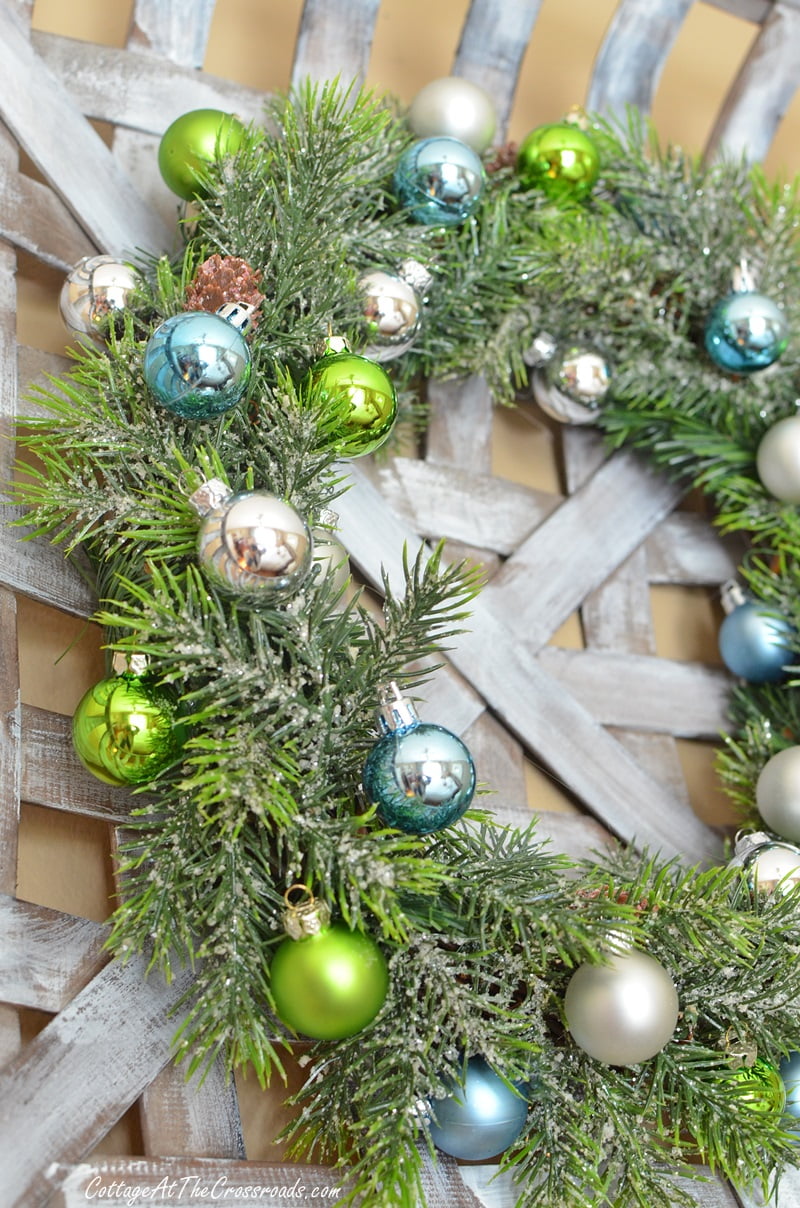 Small ornaments attached to an ornament wreath displayed in a tobacco basket