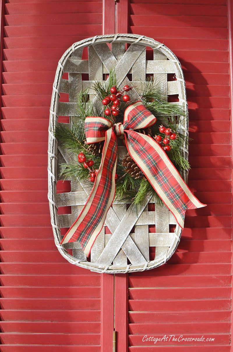 Tobacco basket decorated for christmas with plaid ribbon