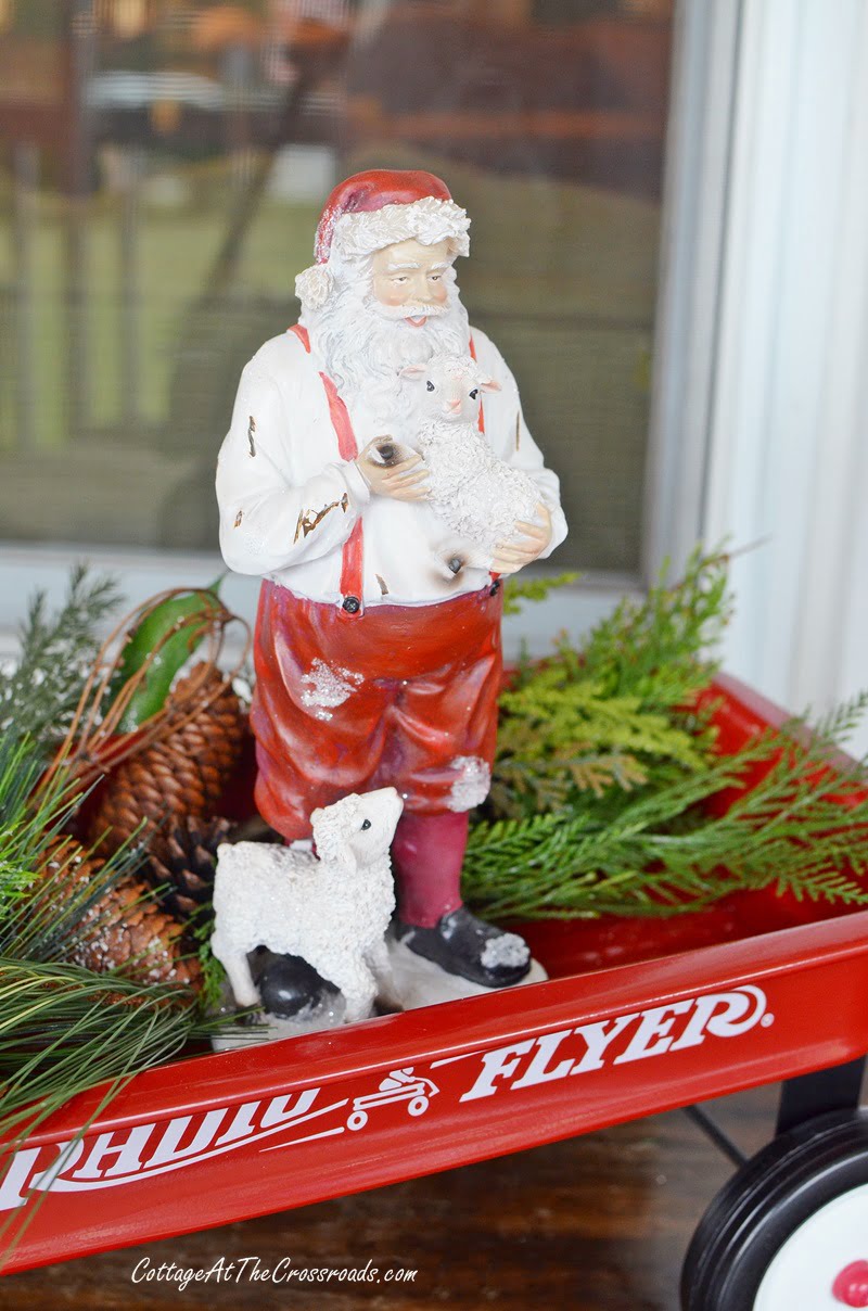 Farmhouse santa on a christmas front porch